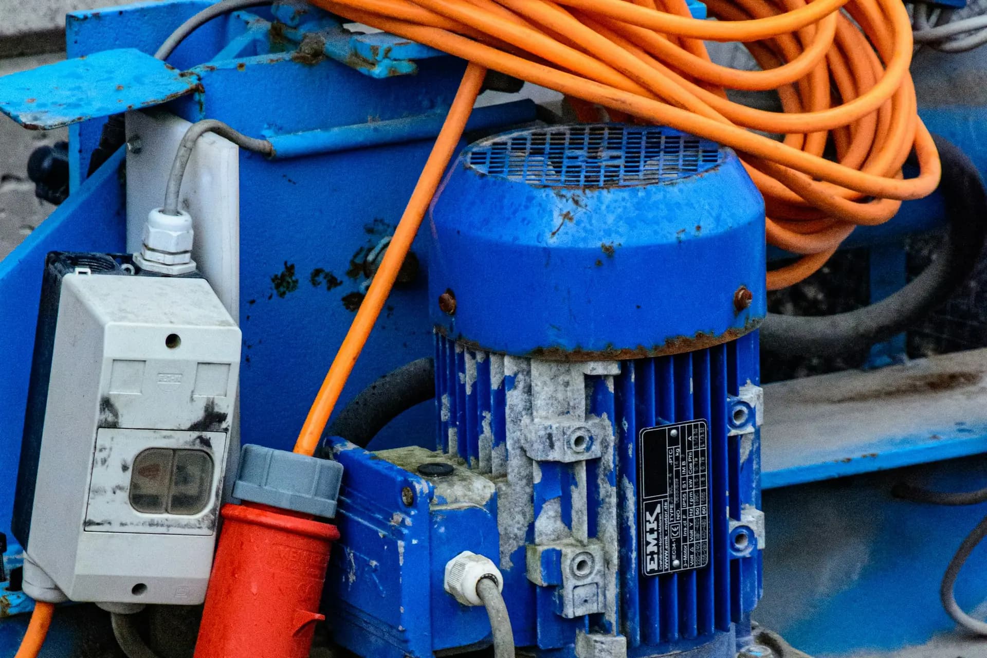 Industrial electric motor with a power connector on a production machine